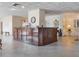 Interior lobby with a dark wood reception desk, tile floors, and elegant decor at 7550 Hinson St # 11C, Orlando, FL 32819