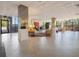 Spacious lobby area with seating, tile flooring, and large windows providing natural light at 7550 Hinson St # 11C, Orlando, FL 32819