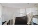 Staircase leading to the balcony with dark hardwood floors at 8322 Lake Lucy Dr, Orlando, FL 32818
