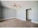 Bedroom with neutral carpet, ceiling fan and closet at 8322 Lake Lucy Dr, Orlando, FL 32818