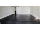 Bedroom with a sliding barn door and dark hardwood floors at 8322 Lake Lucy Dr, Orlando, FL 32818