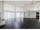 Bright living room with high ceilings, balcony, fireplace and hardwood floors at 8322 Lake Lucy Dr, Orlando, FL 32818