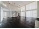Sunlit living room showcasing a balcony, fireplace, and hardwood floors at 8322 Lake Lucy Dr, Orlando, FL 32818