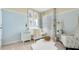 Charming Bedroom with light blue walls, white crib, stylish decor, and a cozy seating area at 911 Princess Sabal Pt, Haines City, FL 33844