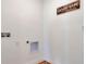 Clean laundry room with hookups, showcasing its functional design and layout at 911 Princess Sabal Pt, Haines City, FL 33844