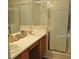 Bathroom features a double sink and a walk-in shower for added convenience at 913 Henley Cir, Davenport, FL 33896