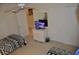 Cozy bedroom featuring a ceiling fan, TV and closet at 913 Henley Cir, Davenport, FL 33896