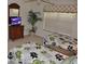 Comfortable bedroom with two twin beds, a dresser with a TV, and a ceiling fan at 913 Henley Cir, Davenport, FL 33896