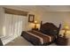 Bedroom boasts a ceiling fan and a window for a light, relaxing space at 913 Henley Cir, Davenport, FL 33896