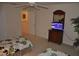 Bright bedroom with two twin beds, a dresser with a TV, and a ceiling fan at 913 Henley Cir, Davenport, FL 33896