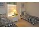 Bright bedroom with two twin beds and sunny window with blinds at 913 Henley Cir, Davenport, FL 33896