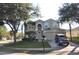 Charming two-story home featuring lush landscaping and an attached two-car garage in a suburban neighborhood at 913 Henley Cir, Davenport, FL 33896