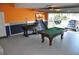 Finished garage featuring a pool table, foosball table, and basketball game at 913 Henley Cir, Davenport, FL 33896