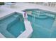 The hot tub has stairs and a railing for easy access to relax at 913 Henley Cir, Davenport, FL 33896