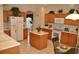 Functional kitchen featuring ample cabinet space, a central island, and modern appliances at 913 Henley Cir, Davenport, FL 33896
