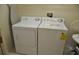Laundry room features a standard washing machine and dryer at 913 Henley Cir, Davenport, FL 33896