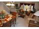 Warm and inviting living room with dining area, plush seating, and decorative plants at 913 Henley Cir, Davenport, FL 33896