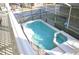 Aerial view of a screened-in pool and spa at 913 Henley Cir, Davenport, FL 33896