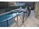Lovely fenced pool and spa area are screened in and overlook the yard at 913 Henley Cir, Davenport, FL 33896