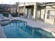 The private screened in pool and spa area complete with lounge chairs and an outdoor dining table at 913 Henley Cir, Davenport, FL 33896