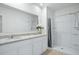 Bathroom features a double vanity with granite countertops and a stand up shower at 993 King Parc Rd, Orange City, FL 32763