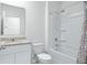 Bathroom featuring a shower and tub combination with tile surround and a granite vanity at 993 King Parc Rd, Orange City, FL 32763