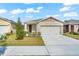 Charming one story home with a manicured lawn, a two-car garage and neutral color palette at 993 King Parc Rd, Orange City, FL 32763