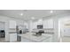 Bright kitchen featuring white cabinets, stainless steel appliances, and granite countertops at 993 King Parc Rd, Orange City, FL 32763