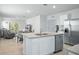 Modern kitchen with stainless steel appliances, island, and granite countertops at 993 King Parc Rd, Orange City, FL 32763