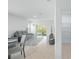 Living area with tile floors, a gray sofa, and sliding glass doors to the outdoor area at 993 King Parc Rd, Orange City, FL 32763