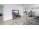 Living area with a media center and access to the kitchen and dining area at 993 King Parc Rd, Orange City, FL 32763