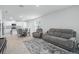 Open-concept living and dining area with modern furnishings and lots of natural light at 993 King Parc Rd, Orange City, FL 32763