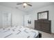 Bedroom features a queen bed, dresser, and access to the bathroom and living area at 993 King Parc Rd, Orange City, FL 32763