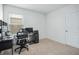 Home office with a desk, computer setup, and natural light from the window at 993 King Parc Rd, Orange City, FL 32763