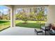 Covered patio with outdoor seating overlooks a well maintained yard and landscaping at 993 King Parc Rd, Orange City, FL 32763