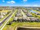 Aerial view showcasing the property's prime location with lush landscaping and water view at 10012 Quail Meadow Aly, Winter Garden, FL 34787