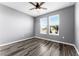 Bright bedroom with wood-look floors offers a lovely view and a serene, light-filled atmosphere at 10012 Quail Meadow Aly, Winter Garden, FL 34787