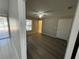 Well-lit bedroom with wood-look flooring and a ceiling fan at 1103 Jade East Ln # 1103, Kissimmee, FL 34744