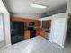 Spacious kitchen with tile floors, stainless steel appliances, and wood cabinets providing storage space at 1103 Jade East Ln # 1103, Kissimmee, FL 34744