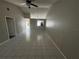 Spacious living room featuring vaulted ceilings and tile flooring at 1103 Jade East Ln # 1103, Kissimmee, FL 34744