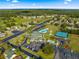 The aerial view displays the community's amenities, including a pool, clubhouse, and tennis courts at 11643 Sw 137Th Loop, Dunnellon, FL 34432