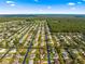 The home's position within a well-planned residential community is seen from above at 11643 Sw 137Th Loop, Dunnellon, FL 34432