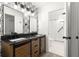 Updated bathroom with dual vanity, modern fixtures, and a glass-enclosed shower at 11643 Sw 137Th Loop, Dunnellon, FL 34432