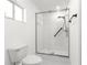 Bright bathroom showcasing glass-enclosed shower and modern fixtures at 11643 Sw 137Th Loop, Dunnellon, FL 34432