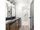 Stylish bathroom featuring double vanity, modern fixtures, and walk-in shower at 11643 Sw 137Th Loop, Dunnellon, FL 34432