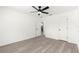 Spacious bedroom with plank flooring, ceiling fan, and ample natural light at 11643 Sw 137Th Loop, Dunnellon, FL 34432