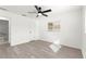 Clean, bright bedroom with plank flooring, ceiling fan, and convenient en-suite bathroom access at 11643 Sw 137Th Loop, Dunnellon, FL 34432