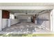 Spacious garage with ample storage cabinets and built-in shelving for organized living at 11643 Sw 137Th Loop, Dunnellon, FL 34432