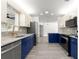 Open concept kitchen with granite countertops, stainless steel appliances, and luxury faucet at 11643 Sw 137Th Loop, Dunnellon, FL 34432