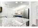 Modern kitchen with stainless steel appliances, new countertops and a view of the backyard at 11643 Sw 137Th Loop, Dunnellon, FL 34432